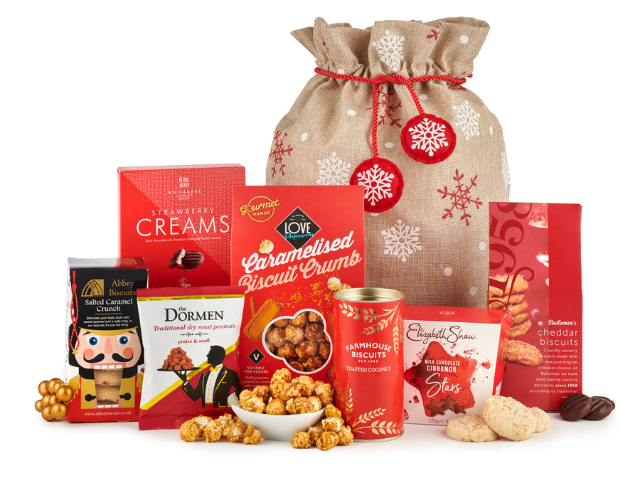 Santa's surprise christmas hamper - spicers of hythe. Featuring Christmas treats from across the UK, with farmhouse biscuits, caramelised biscuit popcorn, cheddar biscuits, strawberry creams & more.